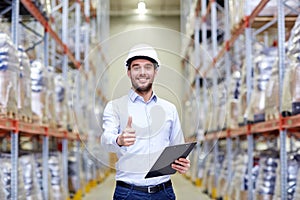 Happy man at warehouse showing thumbs up gesture