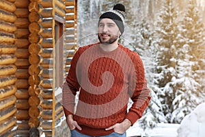 Happy man in warm sweater on winter day