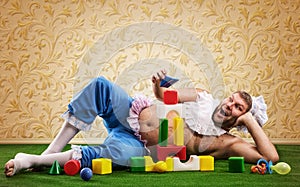 Happy man weared as baby