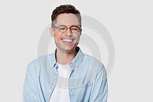 Happy man wearing glasses laughing at joke isolated on background