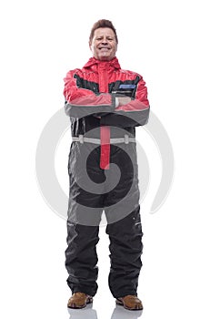 Happy man in winter insulated overalls. isolated on a white