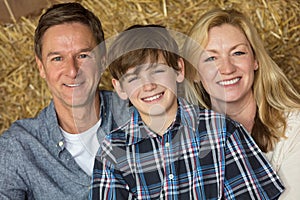 Happy Man Woman Boy Child Family on Hay Bales