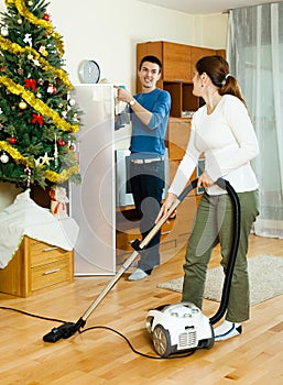 Happy man and woman cleaning
