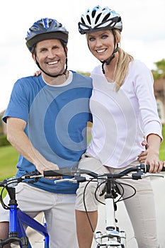 Happy Man & Woman Couple Riding Bikes