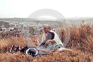 Happy man and woman relaxing in nature