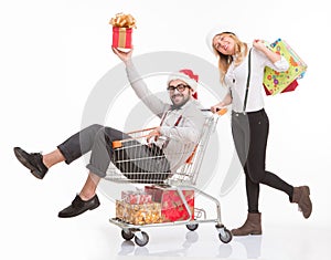 Happy man and woman with shopping cart