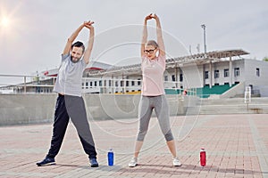 Couple sportsmen training together outdoor