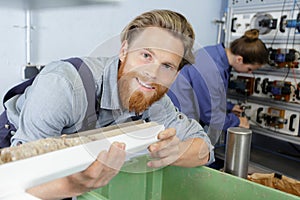 happy man working in wood workshop