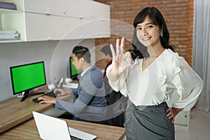 Happy manager asian woman at office