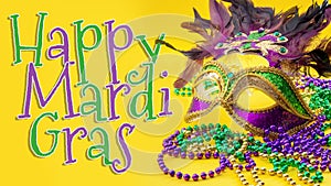 Happy Mardi Gras and Fat Tuesday carnival concept theme with close up on a face mask full of color, feathers and texture and