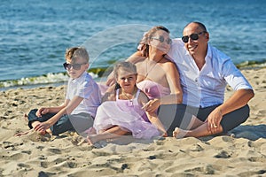 Happy married couple with children on their wedding anniversary day in their wedding dresses .