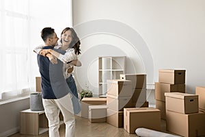 Happy married couple enjoying first relocation, moving activities