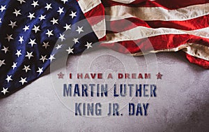 Happy Martin Luther King Day concept.  American flag againt dark stone background photo