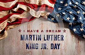 Happy Martin Luther King Day concept.  American flag againt old wooden background photo