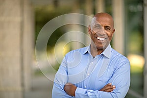 Happy mature African American man at work. photo