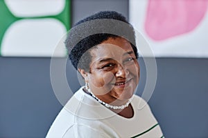 Happy mature African American woman looking at camera with smile