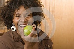 Happy mature African American woman smiling at home.