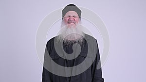 Happy mature bearded hipster man relaxing with eyes closed