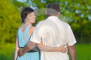 Happy Mature Caucasian Couple Having a Walk Together Outdoors. Embraced Together