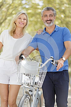 happy mature couple with bilkes