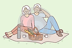 Happy mature couple enjoy picnic