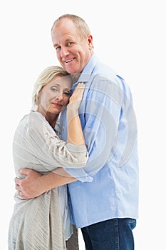 Happy mature couple hugging and smiling