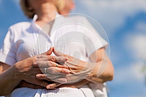 Happy mature couple looking to the blue sky