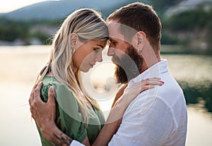 Happy mature couple in love hugging in nature.