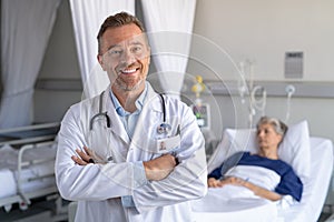 Happy mature doctor at hospital