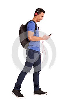 Happy mature man backpack and phone