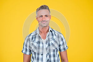 happy mature man with grizzle hair on yellow background