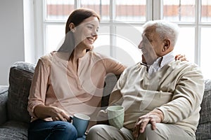 Happy mature man with grownup daughter having fun at home