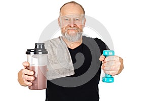 Mature man with protein shake and dumbbell