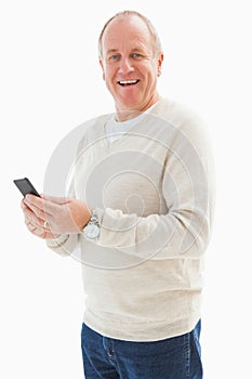 Happy mature man sending a text