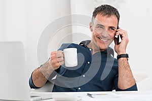 Happy Mature Man Talking On Cellphone