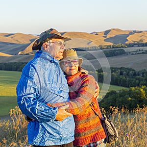 happy mature married couple traveling through the Ural mountains