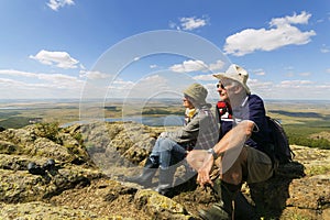 happy mature married couple traveling through the Ural mountains