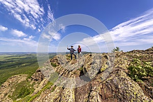 happy mature married couple traveling through the Ural mountains