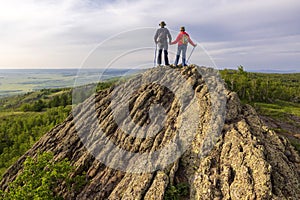 happy mature married couple traveling through the Ural mountains