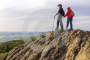 happy mature married couple traveling through the Ural mountains