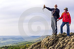 happy mature married couple traveling through the Ural mountains