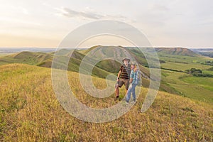 happy mature married couple traveling through the Ural mountains