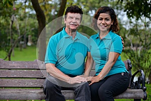 Happy mature multi ethnic married couple together and in love at the park