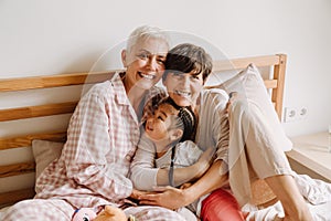 Happy mature same sex couple with adopted asian little girl