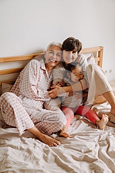 Happy mature same sex couple with adopted asian little girl