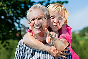 Happy mature or senior couple having walk