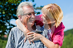 Happy mature or senior couple having walk