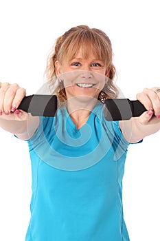 Happy mature woman in blue workout clothes feeling great