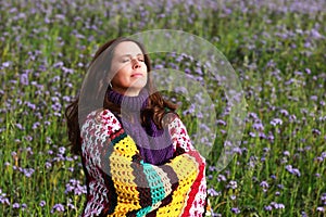 Happy mature woman enjoys the autumn sun