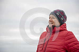 Happy mature woman outdoors on a cold day
